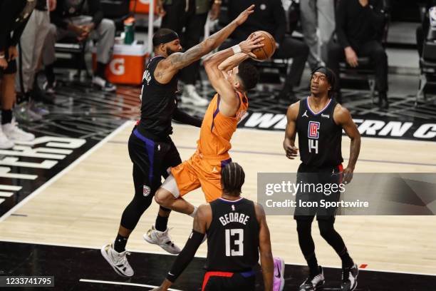 Phoenix Suns guard Devin Booker guarded by LA Clippers forward Marcus Morris Sr. During game 6 of the NBA Western Conference Final between the...