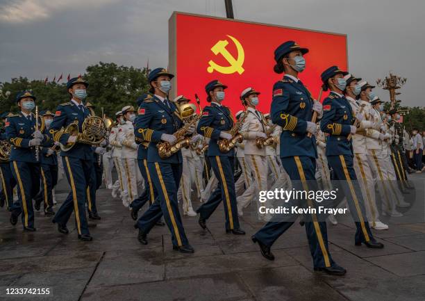 Female members of a People's Liberation Army ceremonial band march at a ceremony marking the 100th anniversary of the Communist Party on July 1, 2021...