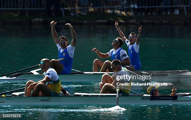 Vincenzo Capelli, Pierpaolo Frattini and Niccolo Fanchi of Italy celebrate winning the Men's Coxed Pair final during day six of the FISA Rowing World...