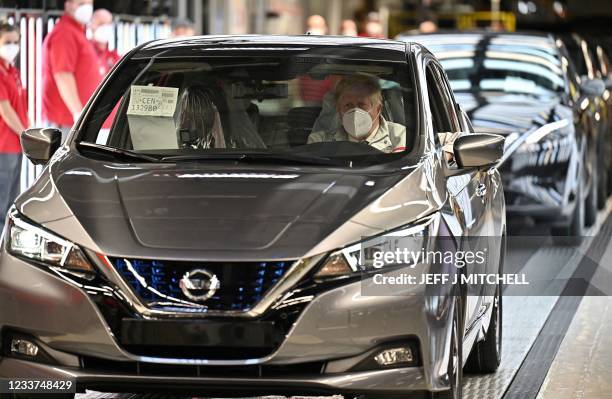 Britain's Prime Minister Boris Johnson tours Japanese auto giant Nissan's production plant in Sunderland, north east England on July 1, 2021. -...
