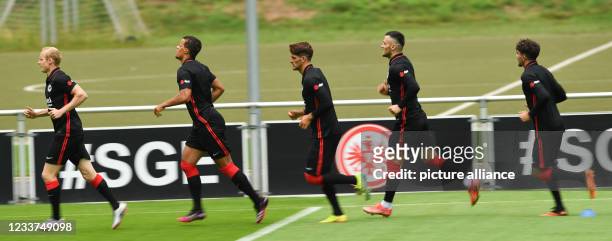 July 2021, Hessen, Frankfurt/Main: Sebastian Rode , Timothy Chandler, Goncalo Paciencia, Filip Kostic and Antonio Foti attend the training kick-off...