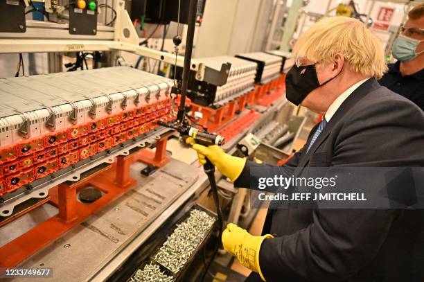 British Prime Minister Boris Johnson visits the Envision battery manufacturing facility at the Nissan production plant in Sunderland, north east...