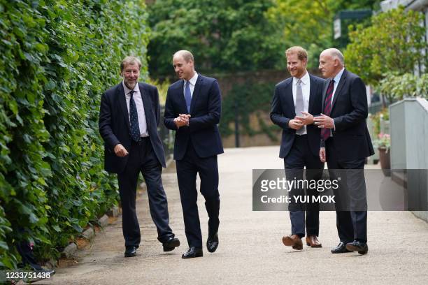 Britain's Prince William, Duke of Cambridge and Britain's Prince Harry, Duke of Sussex talk to Rupert Gavin, Chairman of Historic Royal Palaces and...
