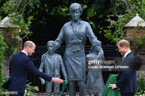 Britain's Prince William, Duke of Cambridge and Britain's Prince Harry, Duke of Sussex unveil a statue of their mother, Princess Diana at The Sunken...