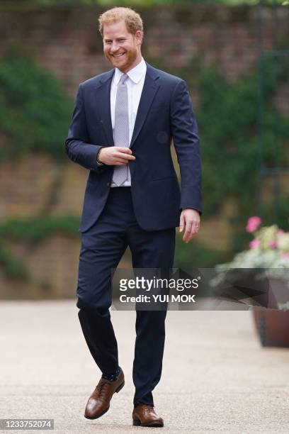 Britain's Prince Harry, Duke of Sussex, arrives for the unveiling of a statue of their mother, Princess Diana at The Sunken Garden in Kensington...