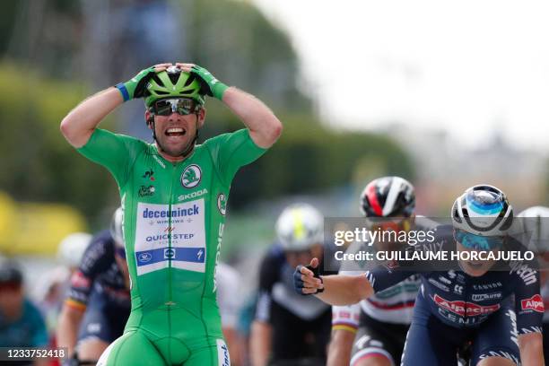 Team Deceuninck Quickstep's Mark Cavendish of Great Britain celebrates as he crosses the finish line of the 6th stage of the 108th edition of the...