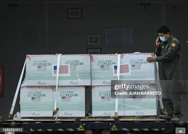 Members of the Colombian Air Force unload 2.5 million dosis of the Covid-19 Janssen vaccine donated by the US, at El Dorado International Airport, in...