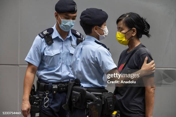 Activist is stopped and searched by police officers during a pro-democracy protest by the League of Social Democrats takes place during the...