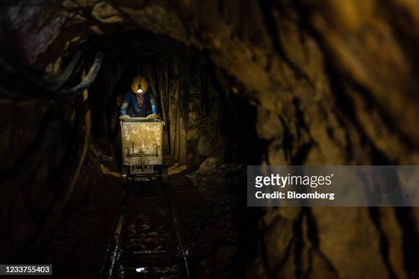 Worker pushes a cart of raw materials at a Gran Colombia Gold mine in Marmato, Caldas department, Colombia, on Tuesday, June 29, 2021. Colombia's...