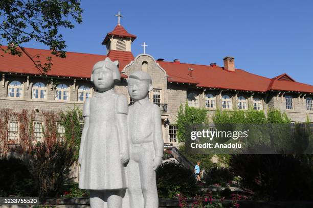 Statue called "The Children" to honour all of all the children who attended Indian Residential schools stands in front of St. Eugene's Mission School...