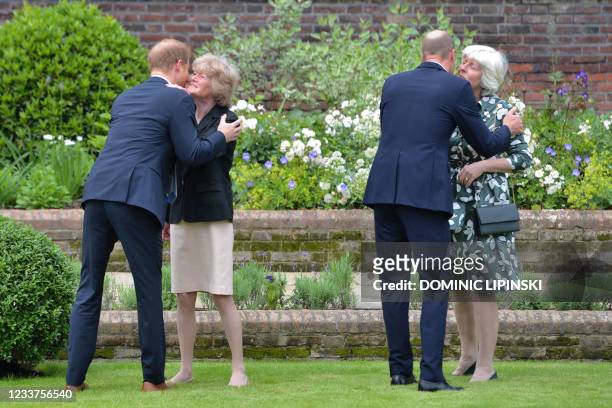 Britain's Prince William, Duke of Cambridge and Britain's Prince Harry, Duke of Sussex greet their aunts Lady Sarah McCorquodale and Lady Jane...