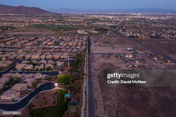 In an aerial view, Urban sprawl spreads across the desert and, increasing water demands as drought continues to worsen on July 1, 2021 in Henderson,...