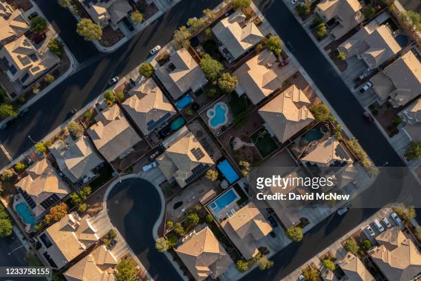 In an aerial view, Urban sprawl spreads across the desert and, increasing water demands as drought continues to worsen on July 1, 2021 in Henderson,...