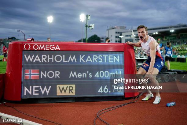 Norway's Karsten Warholm celebrates after winning and breaking the world record during the 400m hurdles men final at the Diamond League track and...