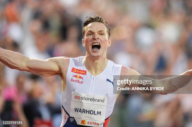 Norway's Karsten Warholm reacts after winning and breaking the world record during the 400m hurdles men final at the Diamond League track and field...