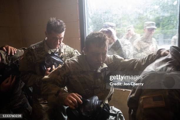 Cadets react to removing their gas masks in The Confidence Chamber, a building filled with tear gas, while in CBRN training during Army ROTC Cadet...