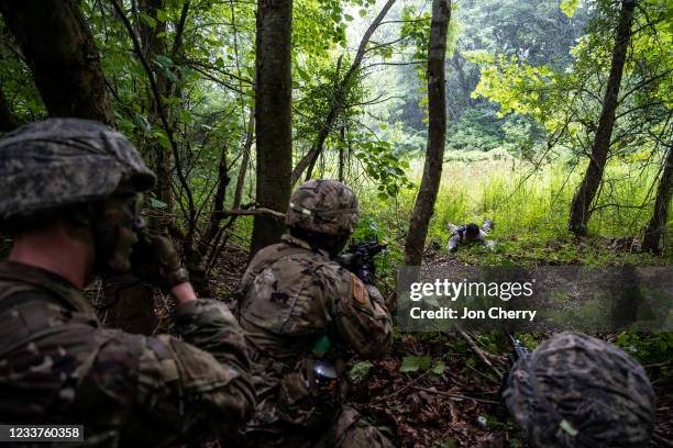 Cadets of the 3rd Regiment aim their weapons at a member of the opposing forces who has approached their perimeter in Training Area 9 during Army...