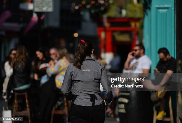 People enjoy the good weather and outdoor drinks in Dublin's Temple Bar. On Thursday, 01 July 2021, in Dublin, Ireland.