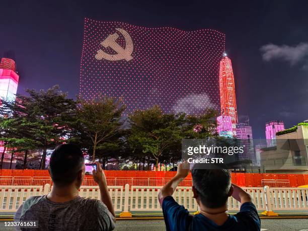 This photo taken on July 1, 2021 shows a flag of the Communist Party of China formed by drones during a show marking the 100th anniversary of the...