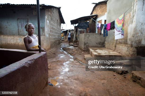 Freetown, SierraLeone Little girl in dirty street of Bomeh Village on June 15, 2021 in Freetown, Sierra Leone. The poorest of the poor have started...