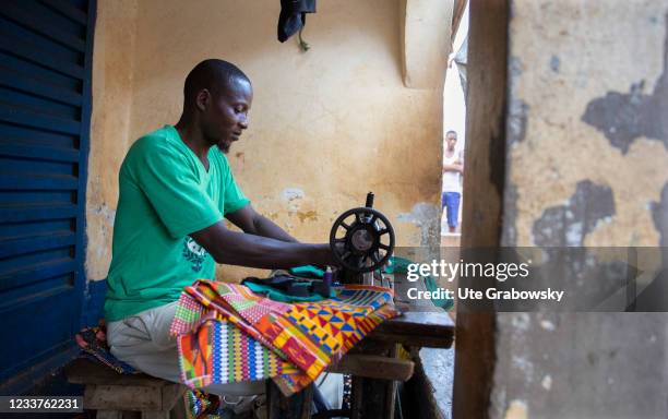 Freetown, SierraLeone Tailor in Bomeh Village on June 15, 2021 in Freetown, Sierra Leone. The poorest of the poor have started to settle on the waste...