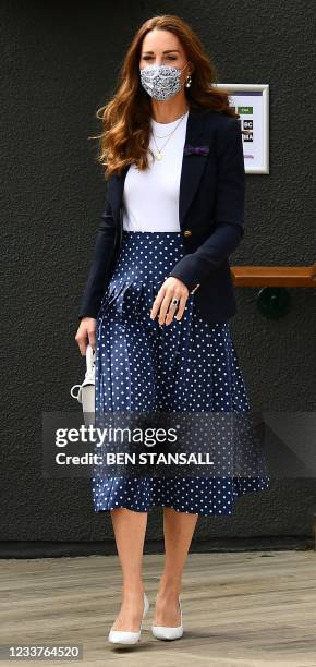 Britain's Catherine, Duchess of Cambridge attends the fifth day of the 2021 Wimbledon Championships at The All England Tennis Club in Wimbledon,...