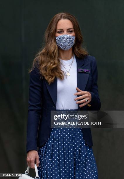 Britain's Catherine, Duchess of Cambridge attends the fifth day of the 2021 Wimbledon Championships at The All England Tennis Club in Wimbledon,...