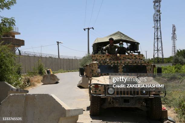 Afghan National Army soldiers stand guard at a road checkpoint outside Bagram Air Base, after all US and NATO troops left, some 70 Km north of Kabul...