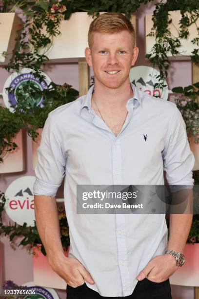 Tennis Player Kyle Edmund poses in evian's VIP suite, certified as carbon neutral by The Carbon Trust, during day five of The Championships,...