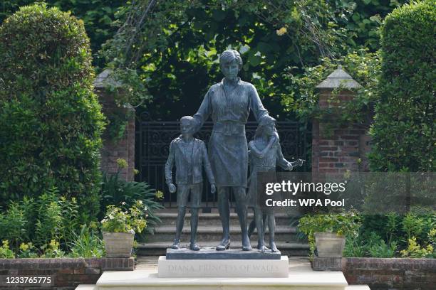 The statue of Diana, Princess of Wales, ahead of the first members of the public being allowed in to view it in the Sunken Garden at Kensington...