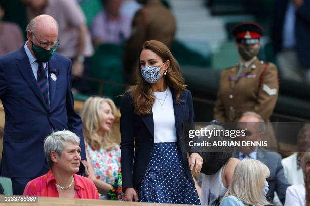 Britain's Catherine, Duchess of Cambridge arrives in the Royal box to watch Tunisia's Ons Jabeur and Spain's Garbine Muguruza during their women's...