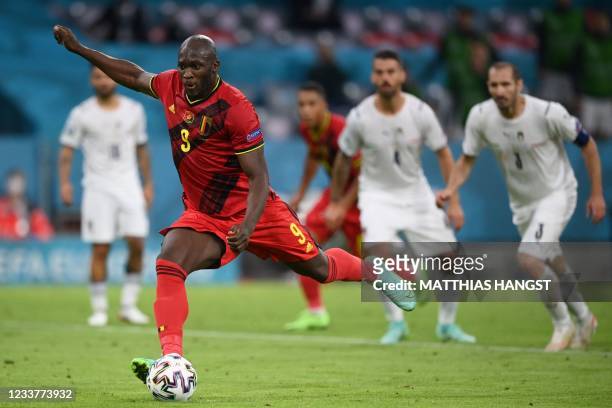 Belgium's forward Romelu Lukaku shoots and scores the team's first goal from the penalty spot during the UEFA EURO 2020 quarter-final football match...
