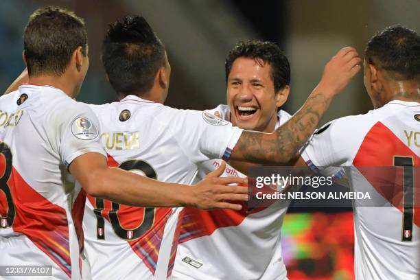 Peru's Gianluca Lapadula celebrates with teammates after scoring his second goal against Paraguay during their Conmebol 2021 Copa America football...