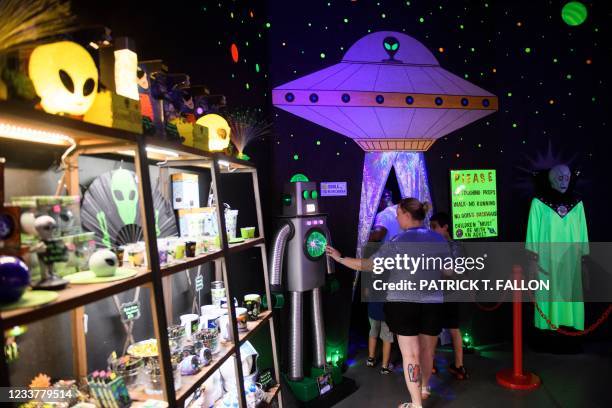 People enter the Roswell UFO Spacewalk attraction during the UFO Festival on July 2, 2021 in Roswell, New Mexico. - The festival returns during the...