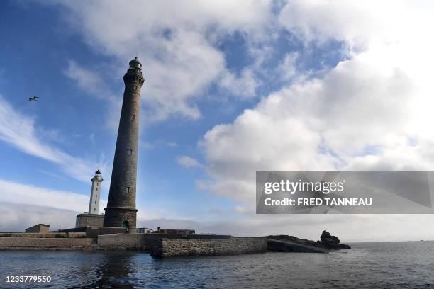 This picture taken June 28, 2021 in Plouguerneau, western France shows the two lighthouses of the Ile Vierge which are now available for rent. - A...