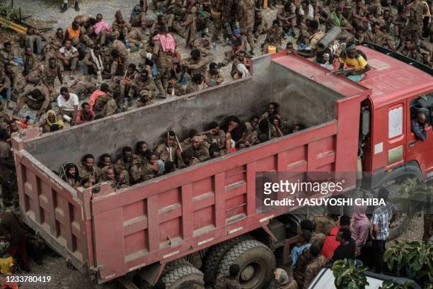 Wounded captive Ethiopian soldiers arrive on a truck at the Mekele Rehabilitation Center in Mekele, the capital of Tigray region, Ethiopia, on July...