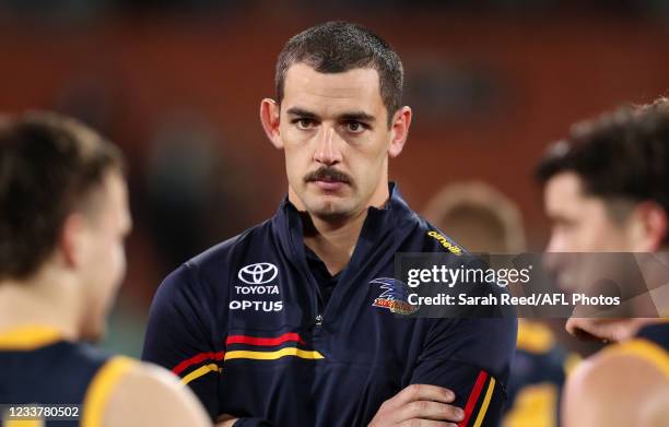 Taylor Walker of the Crows at looks on during the third quarter after suffering a neck injury during the 2021 AFL Round 16 match between the Adelaide...