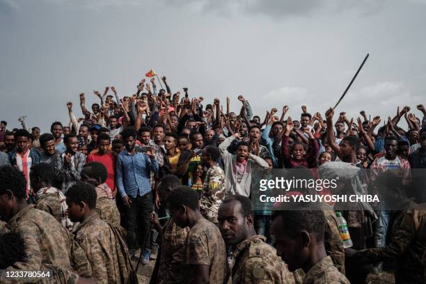 People react as captive Ethiopian soldiers walk towards Mekele Rehabilitation Center in Mekele, the capital of Tigray region, Ethiopia, on July 2,...