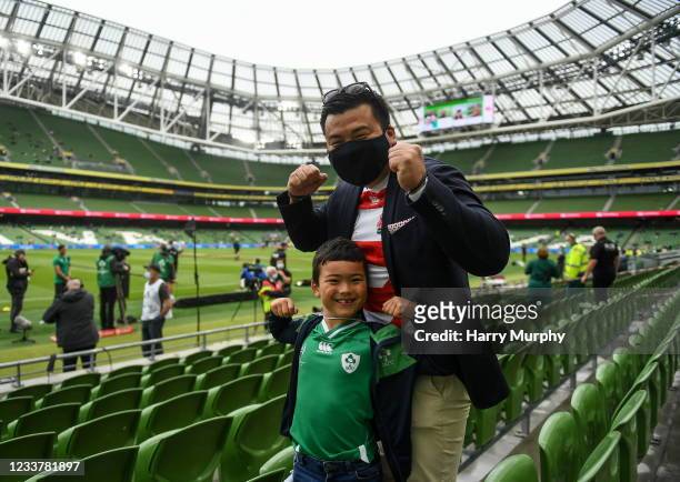 Dublin , Ireland - 3 July 2021; Noah Ino, aged seven, with his father Hiro from Skerries, Dublin, before the International Rugby Friendly match...