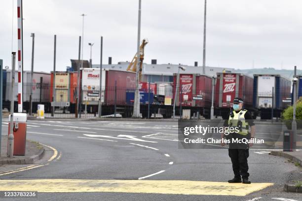 Police officers watch on as Loyalists hold a protest against the Northern Ireland Protocol and the so called Irish sea border at Belfast Harbour on...