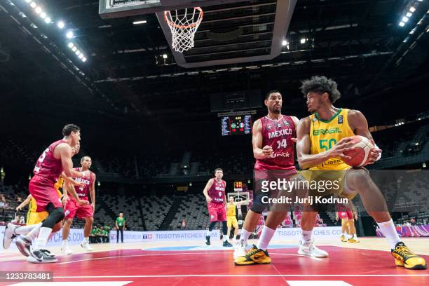 Bruno Caboclo of Brazil and Gustavo Ayon of Mexico fighting for the ball during the 2020 FIBA Men's Olympic Qualifying Tournament game between Brazil...