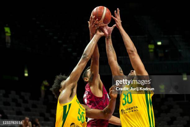 Rafael Hettsheimer and Bruno Caboclo of Brazil and Gustavo Ayon of Mexico fighting for the ball during the 2020 FIBA Men's Olympic Qualifying...