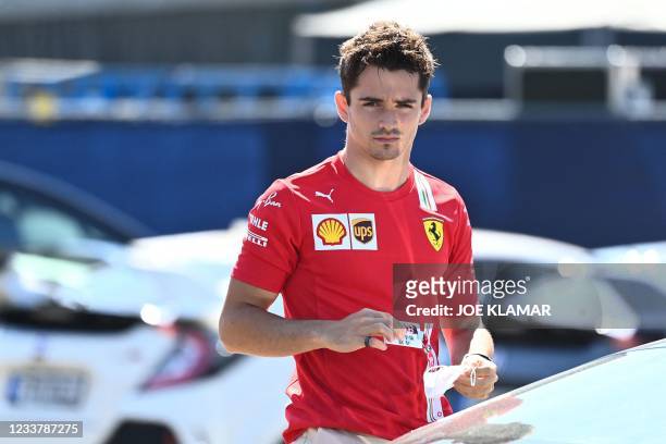 Ferrari's Monegasque driver Charles Leclerc arrives ahead of the third practice session at the Red Bull Ring race track in Spielberg, Austria, on...