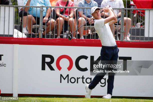 Golfer Cam Davis hits his tee shot on the first hole on July 3, 2021 during the Rocket Mortgage Classic at the Detroit Golf Club in Detroit, Michigan.