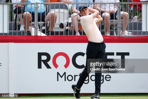 Golfer Davis Thompson hits his tee shot on the first hole on July 3, 2021 during the Rocket Mortgage Classic at the Detroit Golf Club in Detroit,...