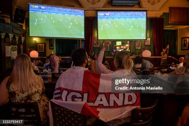English fans watch, in a pub, the UEFA Euro 2020 Championship Quarter-final match between Ukraine and England played at the Olimpico Stadium, on July...