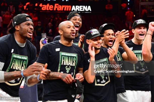 Thanasis Antetokounmpo, P.J. Tucker, Mamadi Diakite, Bryn Forbes, Axel Toupane and Brook Lopez of the Milwaukee Bucks celebrate after winning the...