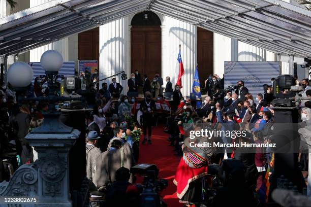 People gather as the constituent Convention ceremony is suspended due to incidents and arrests around the ex national congress before the opening...