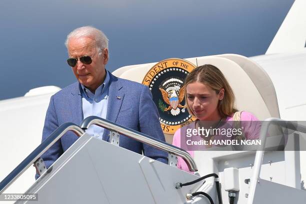 President Joe Biden and granddaughter Finnegan Biden step off Air Force One upon arrival at Andrews Air Force Base in Maryland on July 4, 2021.
