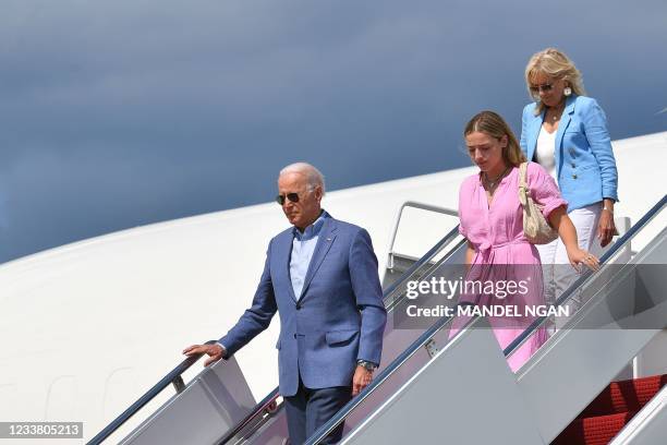 President Joe Biden, First Lady Jill Biden and granddaughter Finnegan Biden step off Air Force One upon arrival at Andrews Air Force Base in Maryland...